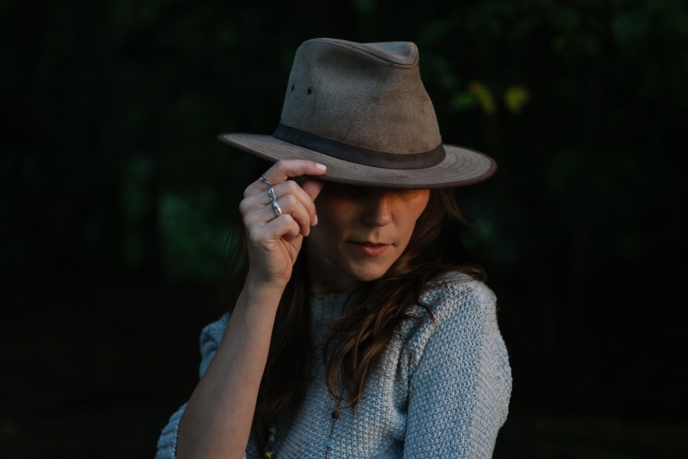 woman tipping her hat