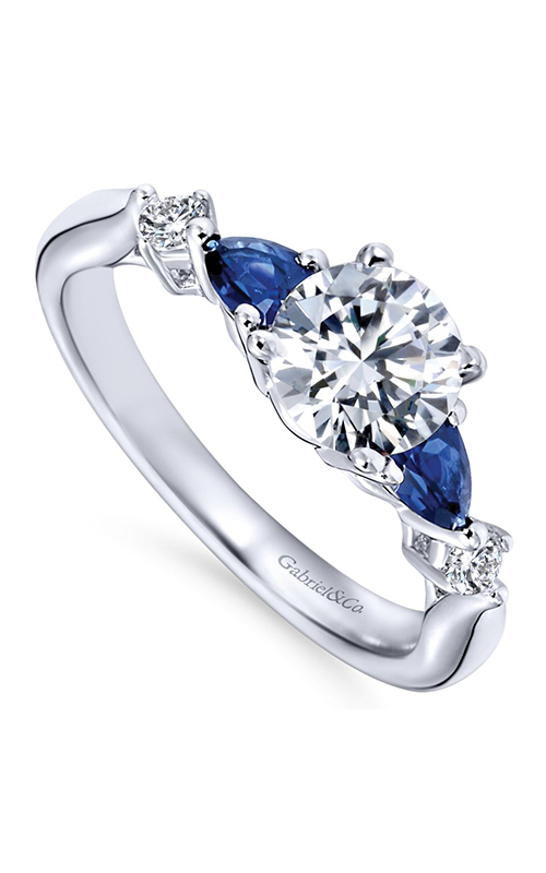A white gold three stone diamond and sapphire engagement ring.