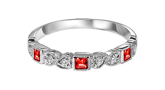 a silver fashion ring featuring rubies and diamonds and milgrain details