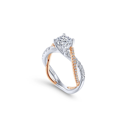 An intertwined mixed metal diamond engagement ring by Gabriel & Co.