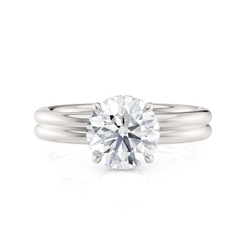 A white gold Michael M double band round cut diamond solitaire engagement ring.