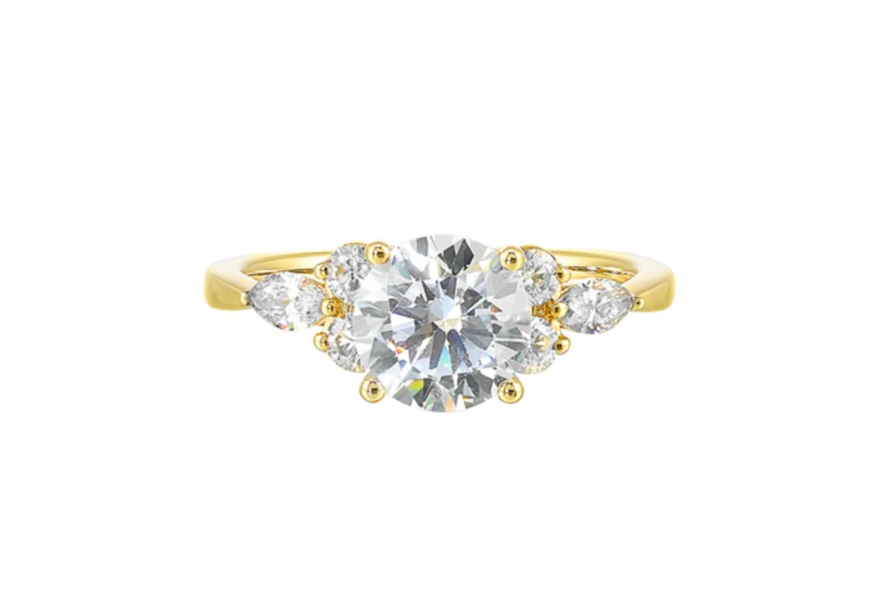 A yellow gold diamond ring with multiple side stones.