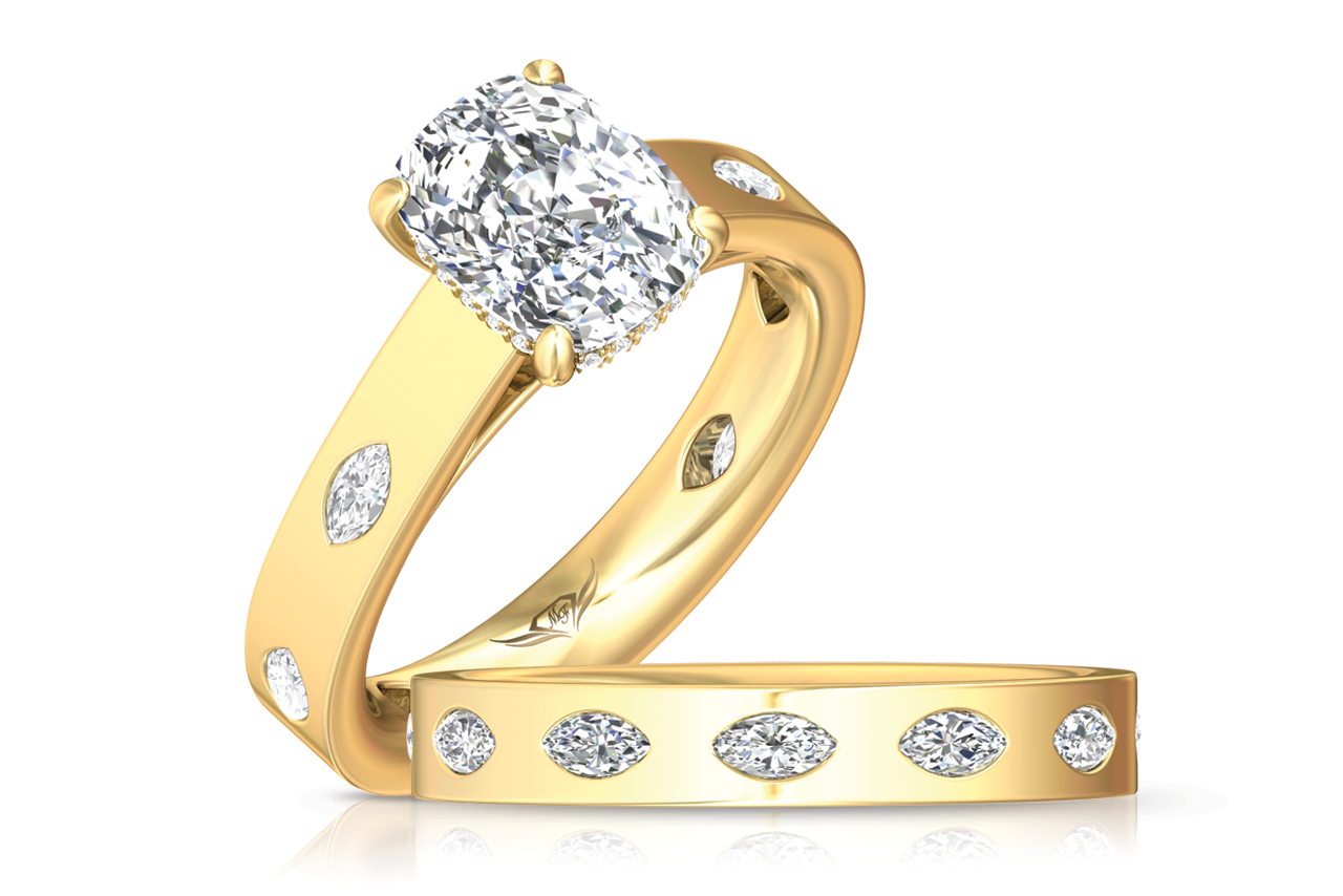 A yellow gold engagement ring with a hidden halo and bezel set marquise diamonds around the band along with a matching wedding band by Martin Flyer A yellow gold engagement ring with a hidden halo and bezel set marquise diamonds around the band along with a matching wedding band by Martin Flyer